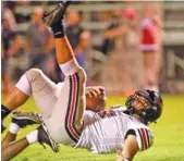  ?? STAFF PHOTO BY ROBIN RUD ?? Maryville quarterbac­k Carson Jones falls into the end zone for the Rebels’ first touchdown Friday night.