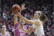  ?? (AP/Darron Cummings) ?? Indiana’s Grace Berger (right) drives to the basket against Iowa’s Kate Martin during the No. 2 Hoosiers’ victory over the No. 5 Hawkeyes on Thursday night in Bloomingto­n, Ind.