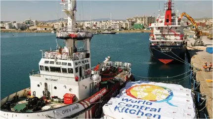  ?? PROACTIVE OPEN ARMS PHOTO VIA AFP ?? SET TO SAIL
The Open Arms vessel (foreground) with the humanitari­an food aid it is towing before it departed for the Gaza Strip from Cyprus’ southern port of Larnaca on Tuesday, March 12, 2024.