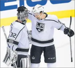  ?? Nick Wass Associated Press ?? KINGS DEFENSEMAN Kurtis MacDermid celebrates with goalie Jonathan Quick after a win against Washington. Quick is on a six-game winning streak.