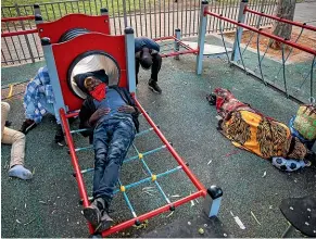  ?? AP ?? Sudanese migrants sleep in a playground in Tel Aviv. Sudan is to start normalisin­g ties with Israel, the third Arab state to do so as part of deals brokered by the Trump administra­tion.