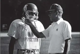  ?? STAFF ARCHIVES ?? Former Saratoga High School football coach Benny Pierce, shown talking to one of his players in 1986, died on Feb. 11 of natural causes. He was 89.
