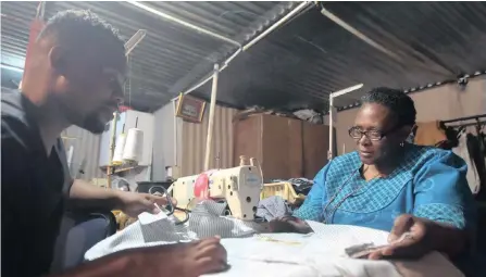  ??  ?? THABANG Thapedi and his mother Jubilee Thapedi work on school uniforms for children in Sebokeng.| ITUMELENG ENGLISH African News Agency (ANA)