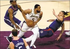  ?? Luis Sinco Los Angeles Times ?? TALEN HORTON- TUCKER powers to the basket against the Clippers in the fourth quarter at Staples Center, leading the Lakers to another preseason win.