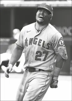  ?? RICHARD W. RODRIGUEZ/AP ?? LOS ANGELES ANGELS’ MIKE TROUT (27) reacts after being hit by a pitch in the fifth inning against the Texas Rangers of a game on Sunday in Arlington, Texas.