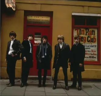  ?? TERRY O’NEILL, GETTY IMAGES ?? Mick Jagger, left, Keith Richards, Bill Wyman, Brian Jones (1942 - 1969) and Charlie Watts in 1963 outside the Tin Pan Alley Club in London.