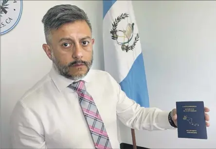  ?? ÁNGEL SALAZAR, Soudi Jiménez Los Angeles Times ?? the Guatemalan consul in Los Angeles, shows a passport waiting to be sent to a citizen who lives in the U.S.