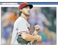  ?? Paul J. Bereswill ?? OH, NOLA: Aaron Nola reacts after allowing a home run to Dominic Smith in the seventh inning of the Phillies’ 4-3 win over the Mets.