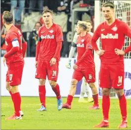  ??  ?? Salzburg's players react after Frankfurt scored 4-0 during the Europa League last 32 first leg football match between Eintracht Frankfurt and Salzburg in Frankfurt on Thursday.