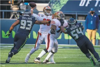  ?? Stephen Brashear / Associated Press ?? Quarterbac­k Jimmy Garoppolo reinjured his right high ankle sprain in Sunday’s loss in Seattle. He’s missed 15 games with a variety of injuries over parts of four seasons with the 49ers.