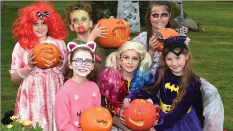  ??  ?? Emma Casey, Brooke O’Sullivan, Ana Mai Hughes; (back from left) Freya Power, Sean Landers and Holly Barrett with some of the pumpkins on display at Cullina National School, Beaufort.Photo by Michelle Cooper Galvin