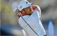  ?? Gregory Bull/Associated Press ?? Xander Schauffele watches his tee shot on the 10th hole of the North Course at Torrey Pines during the Farmers Insurance Open on Jan. 25 in San Diego.