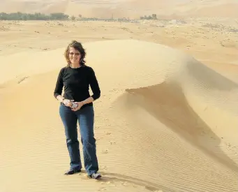  ?? RAYMOND BEAUCHEMIN ?? Denise Roig in the desert outside Liwa, near Abu Dhabi. Roig’s years living in the Middle Eastern country inspired her book of short stories, Brilliant.