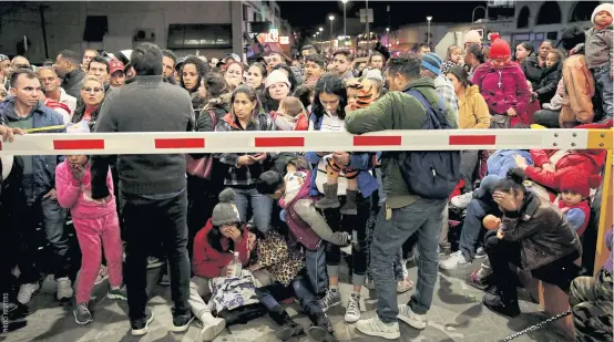  ??  ?? NO ENTRY: Migrants block the Paso del Norte border crossing bridge after a US appeals court blocked the Migrant Protection Protocols programme, which sent asylum seekers back to Mexico to await the outcome of their case, in Ciudad Juarez, Mexico on Friday.