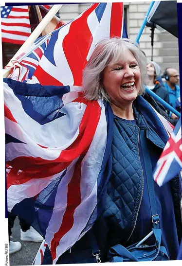  ??  ?? Flying the flag: Celebratin­g Brexit Day in London yesterday