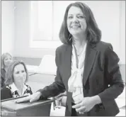  ?? Lorraine Hjalte, Calgary Herald ?? Wildrose Leader Danielle Smith is all smiles as she takes her ballot and votes at the Highwood Memorial Centre in High River on Monday.