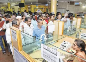  ??  ?? AT A BANK in Vijayawada on November 10, 2016, with customers queueing up to deposit or exchange demonetise­d notes.