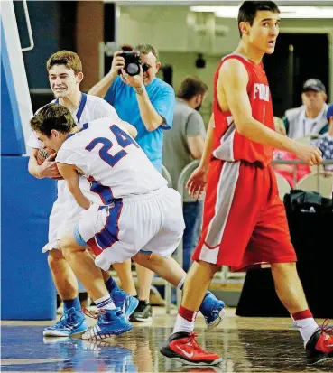  ?? [OKLAHOMAN ARCHIVES] ?? Fort Cobb-Broxton’s Greyden Steinmetz (24) hugs teammate Cameron Hines after the Mustangs beat Forgan for the Class B state championsh­ip in March 2015. Steinmetz and Hines played together one last time Thursday night at the AllState Game in Tulsa.