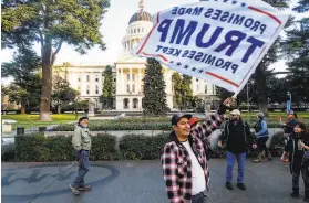  ?? Noah Berger / Special to The Chronicle ?? John, who declined to give a last name, protests last Wednesday in support of President Trump outside the California State Capitol building in Sacramento.