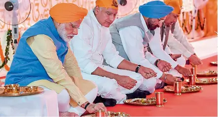  ?? — PTI ?? Prime Minister Narendra Modi eats langar after inaugurati­ng the passenger terminal building of the Kartarpur corridor on the Indian side, also known as Integrated Check Post, in Gurdaspur on Saturday.