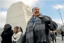  ?? PHOTOS: AP ?? Martin Luther King III, wife Arndrea Waters and their daughter, Yolanda, 9, visit the Martin Luther King Jr Memorial in Washington, DC yesterday.