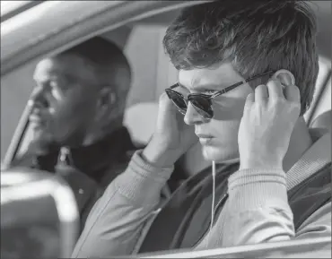  ?? Wilson Webb/TriStar Pictures ?? Ansel Elgort, right, and Jamie Foxx in "Baby Driver."