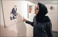  ?? PICTURE: AP ?? An Iranian woman looks at a cartoon mocking US President Donald Trump at an exhibition in Tehran.