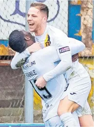  ?? ?? At the double Bruce Anderson celebrates the first of his two goals with team-mate Joel Nouble