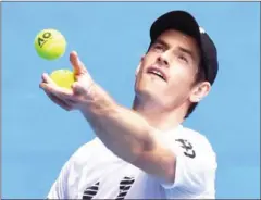 ?? WILLIAM WEST/AFP ?? Andy Murray serves during a practice session on Saturday ahead of the Australian Open in Melbourne, which begins today. Murray has lost in the final of the Grand Slam event five times.