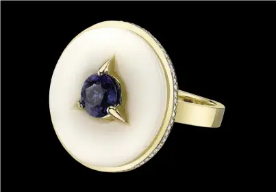  ??  ?? Cycles ring celebrates the cycles of life. 18K yellow gold, 0.18 tcw diamonds, and 1.02 ct. round sapphire inlaid in organic palm ivory.