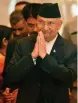  ?? — PTI ?? Nepal Prime Minister Khadga Prasad Sharma Oli exchanges greetings at a business meeting with Indian industry brass in New Delhi on Friday.