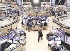  ??  ?? Traders work on the floor of the New York Stock Exchange. — Reuters photo