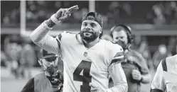  ?? Ron Jenkins / Associated Press ?? Dak Prescott passed for 238 yards and three touchdowns in a rout of the Eagles on Monday night that sent the Cowboys atop the NFC East at 2-1.