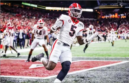  ?? UGA Sports Communicat­ions - Tony Walsh ?? Georgia defensive back Kelee Ringo scores a touchdown on his intercepti­on return near the end of the national championsh­ip game.