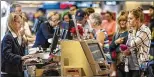  ?? LANNIS WATERS / THE PALM BEACH POST ?? A crowd grows at Palm Beach Internatio­nal’s Delta counter Monday amid fallout from an airport power outage in Atlanta.