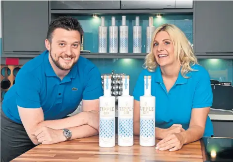  ??  ?? FLAVOUR OF SUCCESS: Laura and Neil, pictured with baby Aiden below, have launched Tipple Gin.