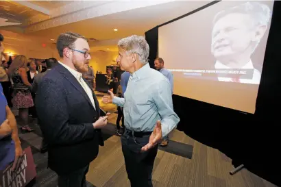  ?? LUIS SÁNCHEZ SATURNO/THE NEW MEXICAN ?? Gary Johnson speaks with supporters at Hotel Albuquerqu­e in August after announcing his candidacy for U.S. Senate.