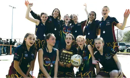  ??  ?? Earning the E grade premiershi­p in overtime are Warragul Industrial­s netballers (back, from left) Lily Sheehan, coach Stacey Lawry, Ariene Start, Makaela Zeldenryk, Mariam Wahid, Tanika Jensen-Thain, (front, from left) Alex Brice, Sienna Green, Zoe Atkins, Ruby Davie and Eilish Kimber.