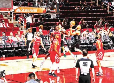  ??  ?? Giannis Antetokoun­mpo of the Milwaukee Bucks goes to the basket against the Houston Rockets on Wednesday at the Toyota Center in Houston, Texas.