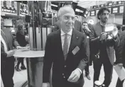  ?? RICHARD DREW/ASSOCIATED PRESS ?? CEO Francesco Starace of Enel, center, visits the New York Stock Exchange trading floor after ringing the opening bell to celebrate the merger creating Enel Americas on Friday.