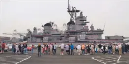  ?? Irfan Khan
Los Angeles Times ?? VISITORS LINED UP early Saturday to tour the battleship Iowa in San Pedro. About 15% of the ship is open to view, but that is expected to rise to 95% by 2015.