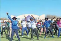  ?? ?? OLDM General Manager Mogakolodi Maoketsa, and Chief Executive of Stanbic Bank Botswana Chose Modise engage in some stretching exercises