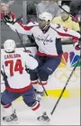  ?? BRIAN SNYDER REUTERS ?? Capitals’ Joel Ward (centre) is swarmed after scoring Game 7 winner vs. Bruins.