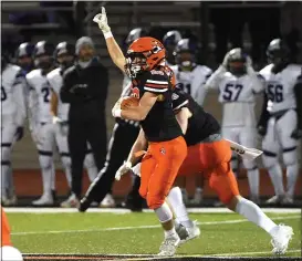  ?? PETE BANNAN - MEDIANEWS GROUP ?? Marple Newtown’s Paul Defruscio is feeling it after intercepti­ng a Phoenixvil­le pass in the first half of what would be a 21-14Tigers victory in the first round of a District 1Class 5A game.