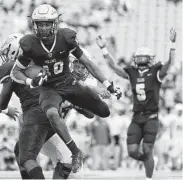  ?? Eric Christian Smith / Contributo­r ?? Klein Collins DB Leroy Ojo (10) returns an intercepti­on 30 yards for a TD to give his team a 28-17 advantage.