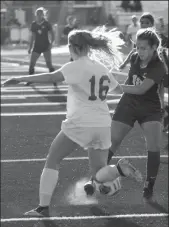  ?? COURTESY PHOTO BY JENNIFER HOWELL ?? Tokay's Tais Villalobos-Gatica (18) attempts to move the ball past Lodi's Kaylie Nies (16) during Wednesday's 3-3 tie between the teams.