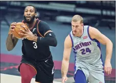  ?? Tony Dejak / Associated Press ?? The Cleveland Cavaliers’ Andre Drummond (3) drives against the Detroit Pistons’ Mason Plumlee in the first half on Wednesday in Cleveland.