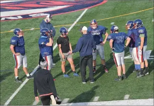  ?? Photos by Ernest A. Brown ?? Lincoln High football coach Sean Cavanaugh (top left) talks to the Lions during Friday’s practice at Ferguson Field. Turn to page B3 for more photos of Lincoln’s preseason practice.