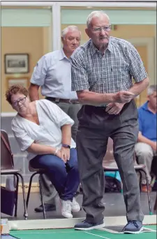  ??  ?? Mairead Keating watching intently as her teammate Dick Mahon bowls during the tournament in Aughrim.