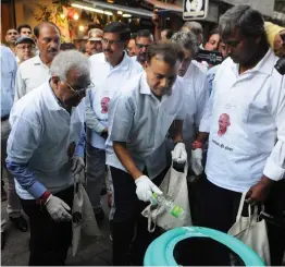  ?? — BIPLAB BANERJEE ?? City police chief Amulya Patnaik takes part in a “Plogging Drive”, launched by the NDMC to inculcate the habit of picking up of litter, on the occasion of the 4th anniversar­y of “Swachchhh Bharat Mission” at Khan Market in New Delhi on Sunday.
